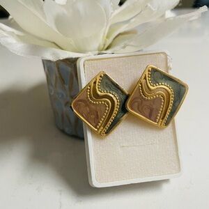Pair of vintage gold-tone earrings with a marbled green and brown swirl design.